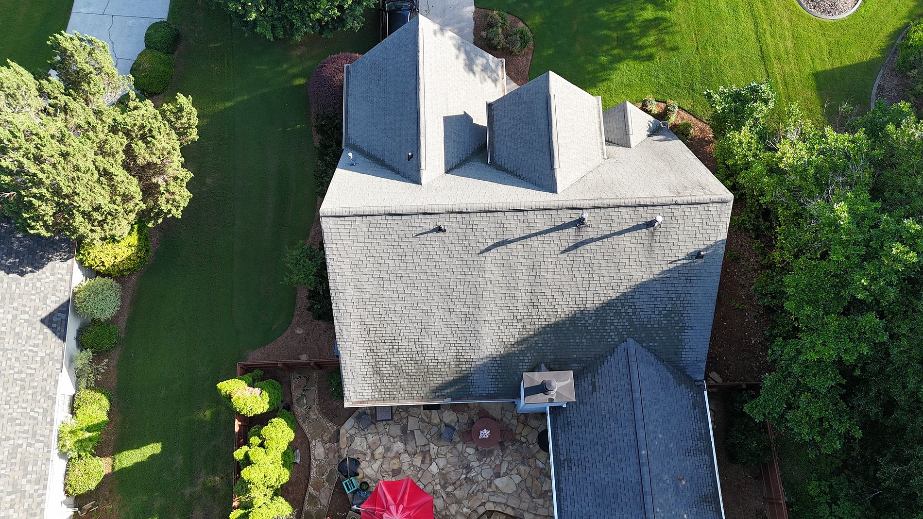 Aerial top-down view of finished Alpharetta roof — TAMKO Titan XT Rustic Black